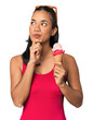 © Asier - Young Filipina in bikini with ice cream looking sideways with doubtful and skeptical expression.