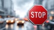 © Oleksandr - Traffic stop sign on a busy city street. Bright red octagonal sign with white STOP lettering, controlling traffic flow. Cars in the background. Safety concept.