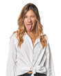 © Asier - Caucasian blonde woman in studio funny and friendly sticking out tongue.