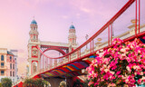 Colorful bridge and towers at sunset in Mega Grand World in Hanoi city town, park Venice, Vietnam