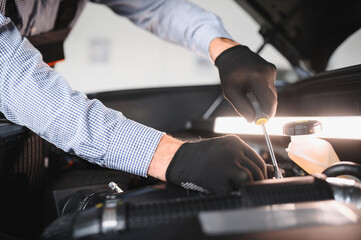 Aufkleber - Troubleshooting process. Auto mechanic working in garage. Repair service