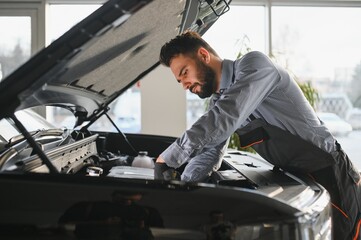 Aufkleber - Troubleshooting process. Auto mechanic working in garage. Repair service