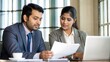 © N7 - Financial consultation between Indian woman banker and customer in formal office