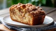 © Velem - Slice of Apple Streusel Coffee Cake on a White Plate