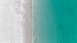 © Austockphoto - Aerial of clear blue water meeting white sand