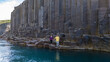 © Fokke Baarssen - Visitors marvel at the breathtaking basalt columns and turquoise waters of Studlagil Canyon in Iceland.