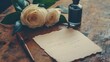 © kirania - A handwritten letter rests on a wooden surface with a bouquet of cream roses and a bottle of ink.