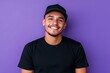 © Maryna - Black Transgender. Latino Man Smiling in Casual Black Attire on Purple Background
