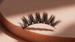 © Sensual - Close-up of dramatic false eyelashes on pink surface with shadow