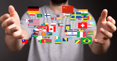 Aufkleber - Image of a man holding a network of international flags, symbolizing global connections and international relations.