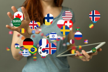 Aufkleber - Global communication, international business, worldwide network concept. Woman using tablet with world flags.