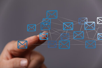 Poster - Hand interacting with digital email icons, representing global communication and networking.