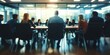 © xartproduction - Blurred Business Meeting in Modern Office