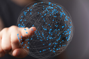 Leinwandbilder - Abstract image of a hand interacting with a digital sphere representing global network connections.
