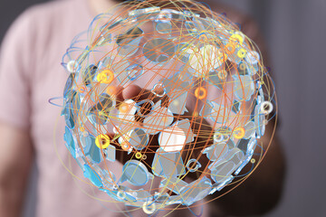 Aufkleber - Person interacts with a digital globe, showing global networking and connections.