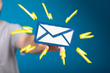 Aufkleber - A hand holding a vibrant email icon, symbolizing fast and efficient communication.