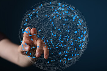 Fototapete - Abstract image of a hand interacting with a digital network sphere, representing global connectivity and data.