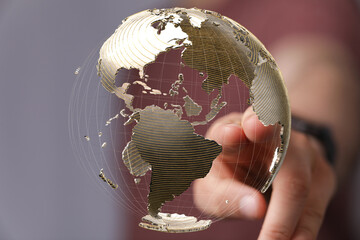 Fototapete - High-quality stock photo of a hand interacting with a 3D model of the Earth, symbolizing global connection and networking.