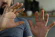 © vegefox.com - Close-up of a man's hands gesturing rejection or denial.  Perfect for concepts of refusal, stop, or boundary.