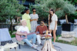 © nazariykarkhut - Multicultural group of people, man playing guitar and friends dancing, singing and having fun