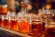 © Віталій Б. - Golden honey flows from a spoon into neat glass jars arranged on a rustic wooden table. The warm lighting creates a cozy atmosphere, highlighting the rich texture and color of the honey