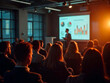 © ivan canavera - Audience attending a professional meeting with charts and analytics displayed