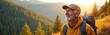 © Vadym - Happy old hiker with backpack enjoys mountain top forest view. Senior man with cap smiles looking at landscape. Retired person on nature walk outdoor in sunlight.