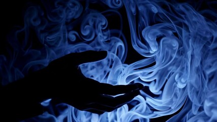 Wall Mural - Silhouette of a Hand Reaching Out of Blue Smoke Against a Dark Background
