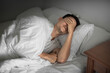 © kieferpix - Sleepless man lying in bed feeling tired exhausted stressed waking up unmotivated