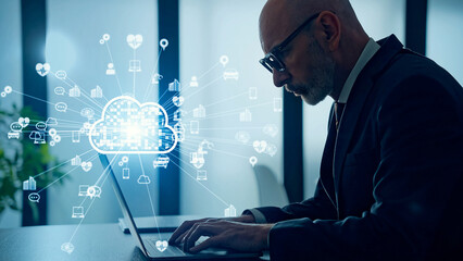 Poster - Conceptual visual of a middle-aged Caucasian man using a computer in an office and cloud computing