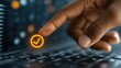 © Spartan - A hand touches a glowing checkmark on a laptop keyboard
