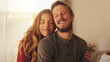 © LuxeShutter24/peopleimages.com - Smile, couple and embrace in home for love, care and support with partner. Happy man, woman and connection in living room for healthy relationship, loyalty and commitment for marriage together