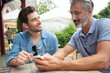 © auremar - meeting of two male friends in bar