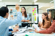 © Yingyaipumi - Group of creative Businesspeople brain storm meeting presentation,discussing roadmap to product launch, planning,strategy,dashboard,new business development,working with new startup project in office
