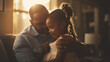 © Prostock-studio - This Father embraces daughter in a cozy setting, sharing wisdom and love during a quiet evening.