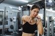 © Phimwilai - Asian sportswoman boxing in the gym showing strength and fitness