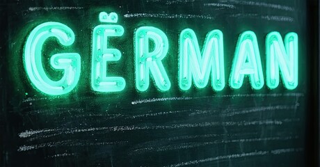 Aufkleber - Bright neon sign displays word German. Dark background emphasizes glowing turquoise lettering. Simple, bold presentation.