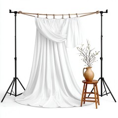 Wall Mural - A white fabric backdrop is draped elegantly for a studio photoshoot setup.