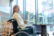 © zinkevych - Caucasian mid aged woman on a wheelchair in a rehabilitation center