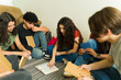 © AntonioDiaz - Group of high school students reading and studying together in book club