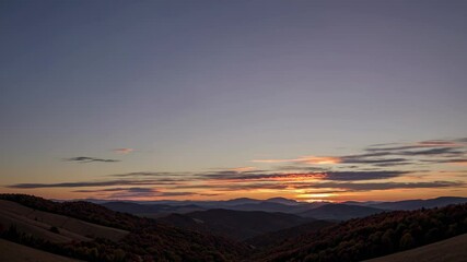 Wall Mural - sunlight casting golden glow across mountain peaks, revealing dramatic silhouettes during early morn