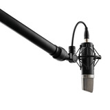 A microphone with a boom arm against  on a transparent background