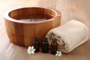 Aufkleber - Relaxing Foot Soak Experience With Wooden Basin, Towel, and Essential Oils at Home Spa Setting