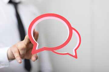 Aufkleber - Image of a businessman interacting with digital speech bubbles, symbolizing communication and conversation.