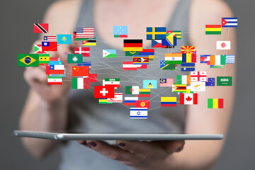 Poster - Person interacting with a digital network of global flags on a tablet.  Concept of international connection and communication.