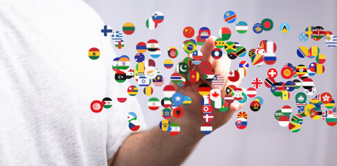Poster - Image depicts a hand interacting with a digital display of numerous national flags, symbolizing global connections.