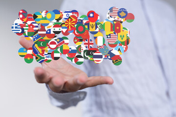 Poster - Hand holding diverse flags. Global business, international cooperation, world map concept.