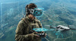 © Cliff - Female soldier drone operator wearing virtual reality glasses controls drone during training