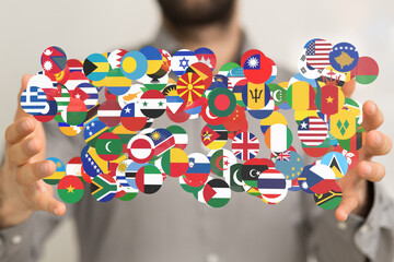 Poster - Image of hands holding various national flags, representing global unity and international relations.