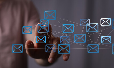Poster - Hand interacting with a digital network of email icons.  Modern communication.